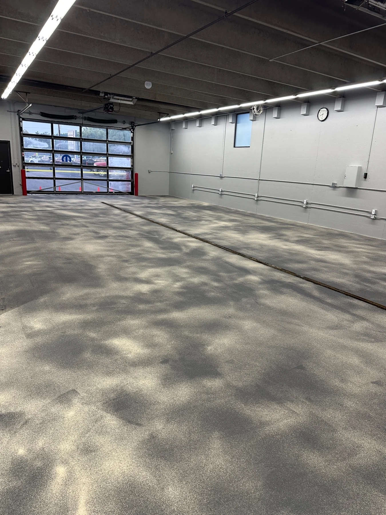 Commercial flooring system during installation on the same documented E&M project